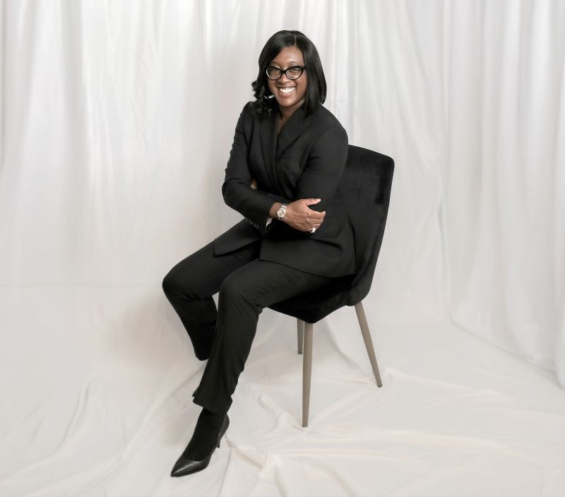 Dr. Eniola Salami, seated.