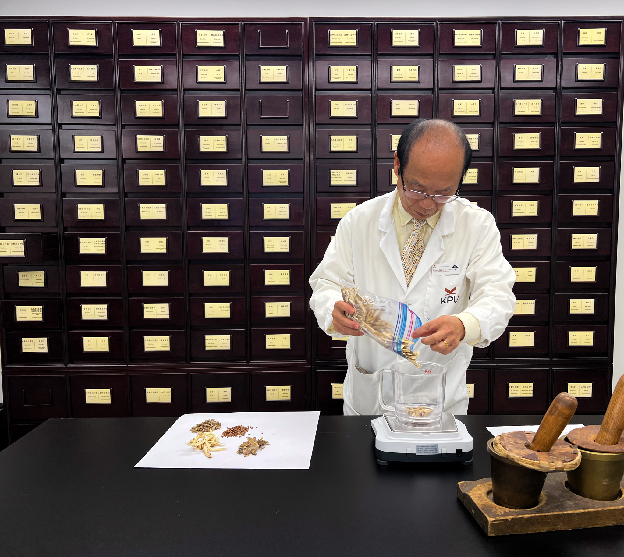 Dr. John Yang inside the herbal dispensary at KPU.