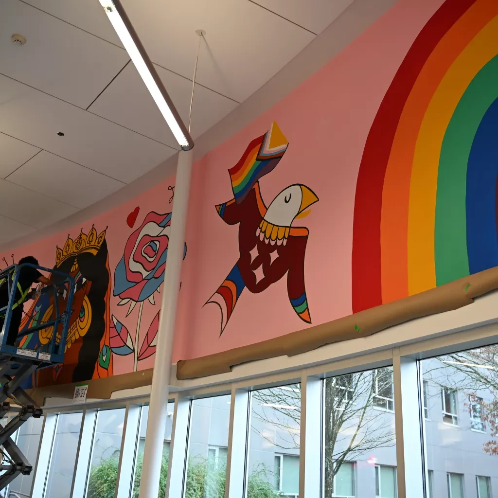 Jag Nagra painting the surrey mural