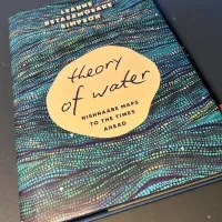 Book cover titled "Theory of Water: Nishnaabe Maps to the Times Ahead", by Michi Saagiig Nishnaabeg artist and academic Leanne Betasamosake Simpson.